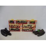 A box of oo gauge railway track, small quantity of boxed trackside vehicles etc.