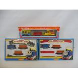 Two Hornby Thomas the Tank Engine clockwork trains and a Playcraft Junior set.