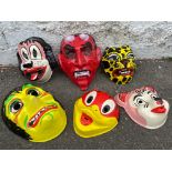 Six fairground face masks.