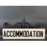 A double sided sign for Accomodation, set within a wrought iron frame, 37 x 21 1/2".