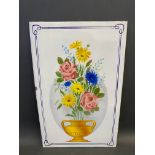 A rare enamel sign depicting a vase of brightly coloured flowers, excellent condition, 15 x 24".