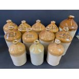 A collection of 12 stoneware flagons, all of local interest, including Bradford on Avon, Chippenham,