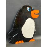 A fairground painted sign in the shape of a penguin, 18 1/2 x 24 1/2".