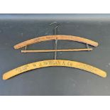 Two wooden hangers, one advertising W.O.Morgan & Co. Tailors.