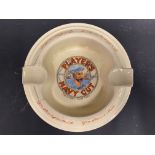 A Player's Please/Navy Cut pictorial ashtray with sailor image to the centre.