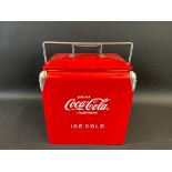 A reproduction Coca Cola Ice box, 12 1/2" w x 14 1/2" h x 9 1/2" d.