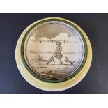 A Royal Doulton circular baby plate/change tray with Christopher Robin inspired image, 8" diameter.