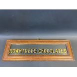 A Rowntree's Chocolates glass advertising panel, framed, 15 1/4 x 5".