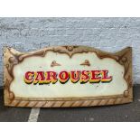 A colourful rounding board from a fairground carousel, with the word 'Galloping' painted to the