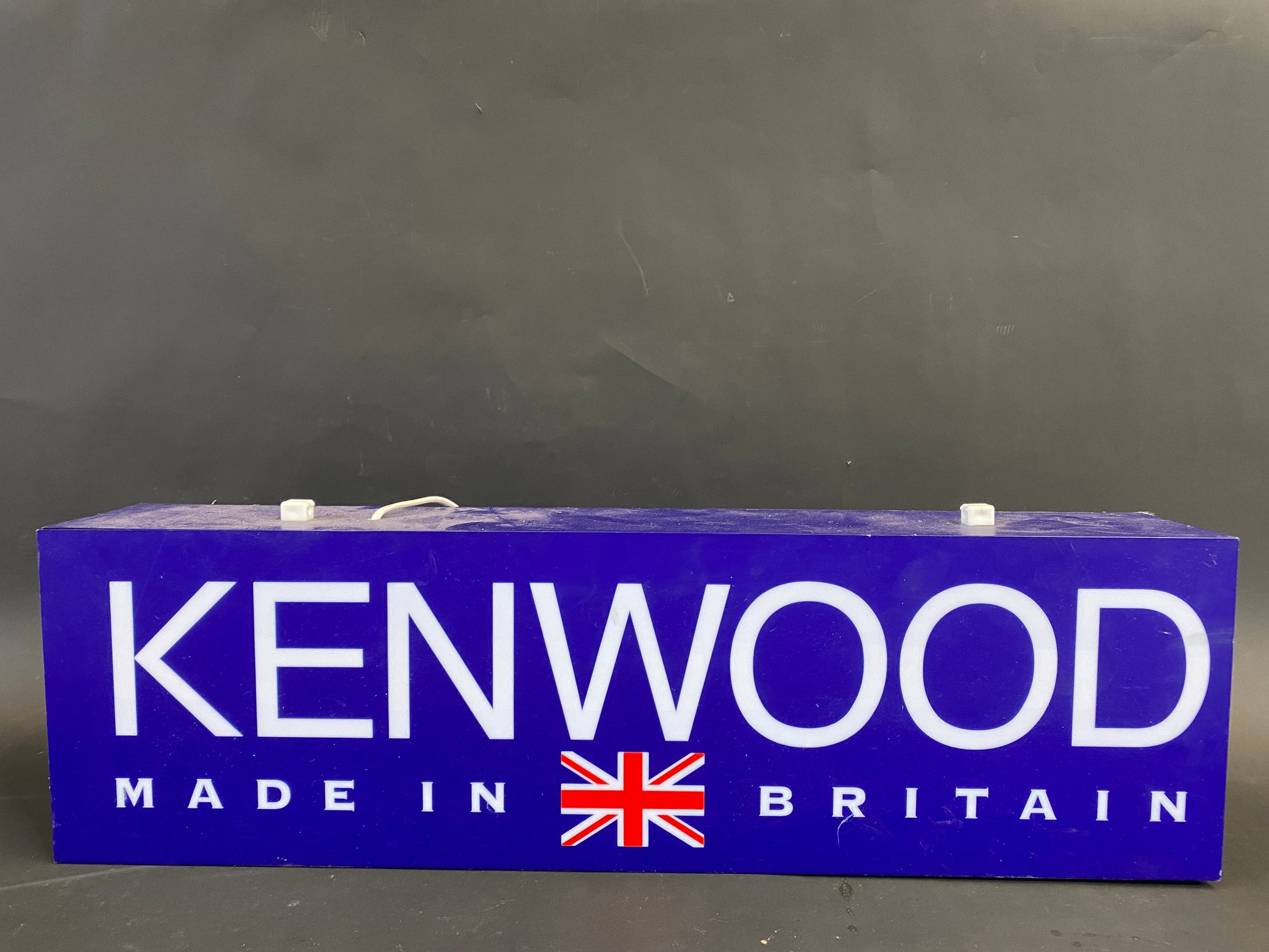 A contemporary Kenwood double sided illuminated lightbox, 25 1/2" w x 7 1/2" h x 4" d.