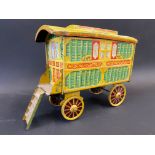 A Chad Valley for Jacob's Biscuits tin in the form of a Romany caravan.