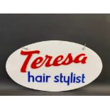 An oval hanging perspex sign advertising 'Teresa hair stylist', 25 x 14".