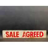 A Sale Agreed/Sold wooden sign, 32 x 6".