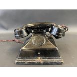 A small childs bakelite telephone modelledon the 1930s GPO 232.