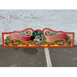 A highly decorated panel from the top of a juvenile fairground ride, painted in the 1970s, but never