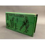 A rare green enamel matchbox holder, decorated with a cricketing scene, and bearing the words 'The