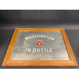 An older reproduction Worthington in Bottle advertising mirror within a maple veneered frame, 22 1/2