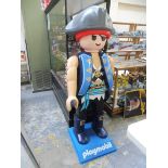 A large scale toy shop Playmobil advertising figure.