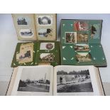 Three postcard albums containing an assortment of mainly early 20th Century postcards, including two