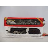 A boxed Hornby oo gauge locomotive Black Five steam with tender.