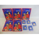 A set of unused ex-shop stock E.T. badges, plus five excellent condition carded pieces of