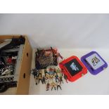 A large quantity of small scale wrestler figures with accessories, ring etc.