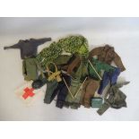 A large quantity of Action Man British uniforms and accessories.