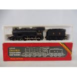 A boxed Hornby oo gauge Class 12 locomotive and tender.