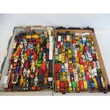 A large quantity in two trays of die-cast vehicles to include Lesney, Matchbox etc. all playworn.