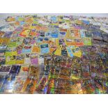 A selection of Pokemon cards, different eras, some shiny.
