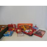 A selection of period toys, mainly plastic.