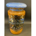 A large glass lidded chemist jar bearing the name Peruv:Bark, 21" high.