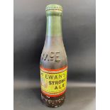 A large dummy beer bottle advertising McEwan's Strong Ale, 33" high.