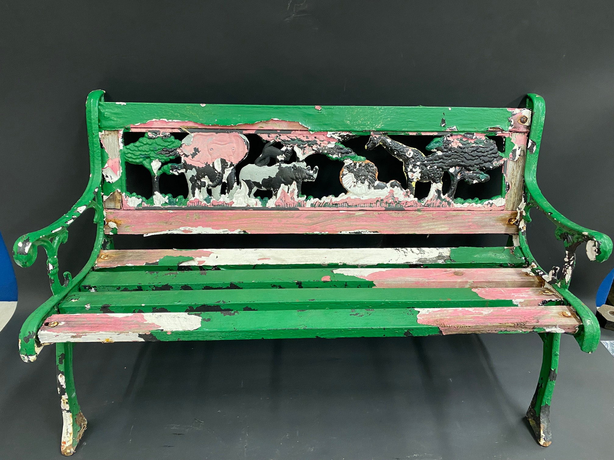 An unusual children's bench, the back support in the form of wild animals including a camel and an