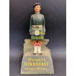 A Grant's Standfast Scotch Whisky advertising figure, 10" h.