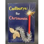 A Cadburys for Christmas pictorial showcard, with a simulated candle and tinsel attached, 10 3/4 x