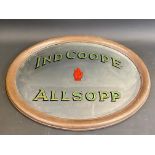 An oval advertising pub mirror for Ind Coope Allsopp, 22 1/2 x 18 1/4".