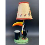 A Guinness toucan table lamp by Carltonware, with original shade, restored.