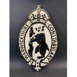 A Warwickshire Constabulary aluminium wall plaque with central dancing bear motif, 13 x 22".