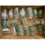 A box of reproduction- labelled glass jam jars.