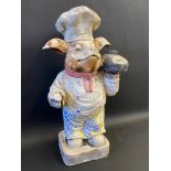 A butcher's shop window advertising figure of a standing pig dressed as a butcher, 24 3/4" tall.