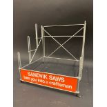 A circa 1970s shop counter dispensing rack advertising Sandvik saws, 12" w x 12" h.