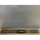 A framed Crawford's Delightful Biscuits glass advertising panel, 48 x 4 3/4".