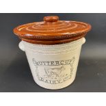 A Buttercup Dairy Co. Crock with illustrtaion of a cow to front, 7" high.