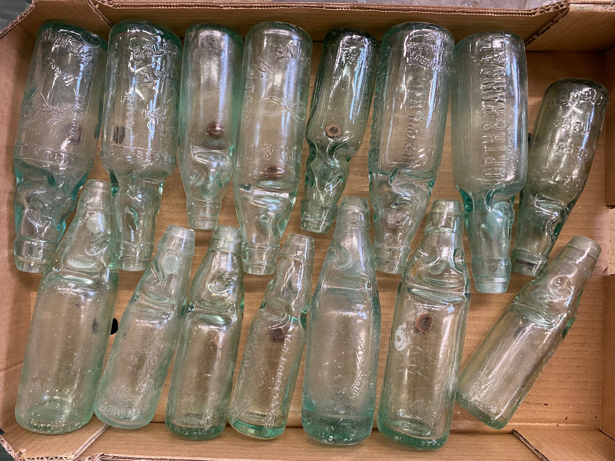 An assortment of glass cod bottles.