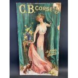 A Victorian pictorial advertisement advertising C.B. Corsets, depicting an elegant lady with a