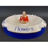 A Flowers brewery oval ashtray by Carltonware, with central figure of Shakespeare, 9" w.