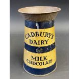 A Cadbury's Dairy Milk Chocolate tin in the shape of a milk churn, 6" h.