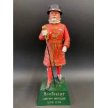 A Beefeater London Distilled Dry Gin advertising figure, 11 1/2" h.