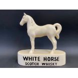 A White Horse Scotch Whisky double sided advertising figure in the form of a standing horse, 8 1/